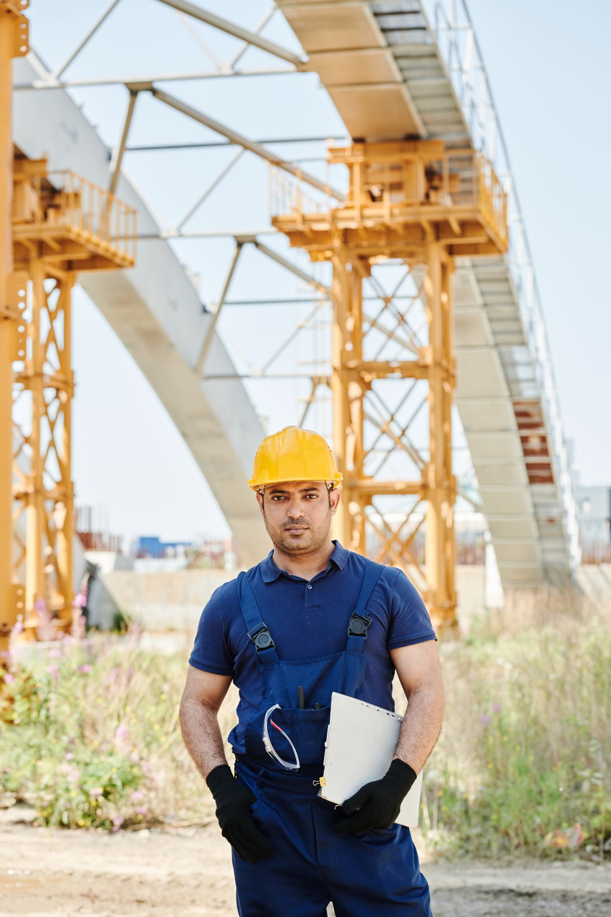 Field technician using a tablet during a site inspection